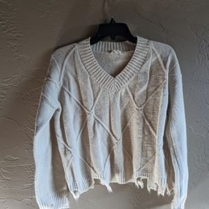 Hem and thread sweater
